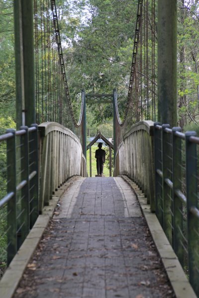 Suspension Bridge at Loch, Gippsland. Suspension bridge at Loch, Gippsland, with the war memorial framed at the end.