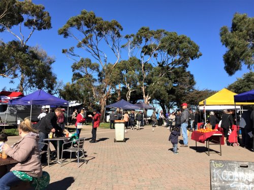 Stalls and shoppers at the Churchill Island Farmers Market.
