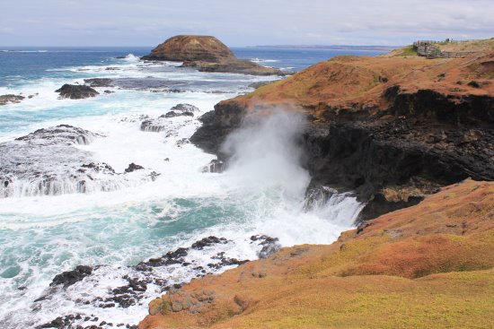 The Blowhole at The Nobbies spraying plume into the air.