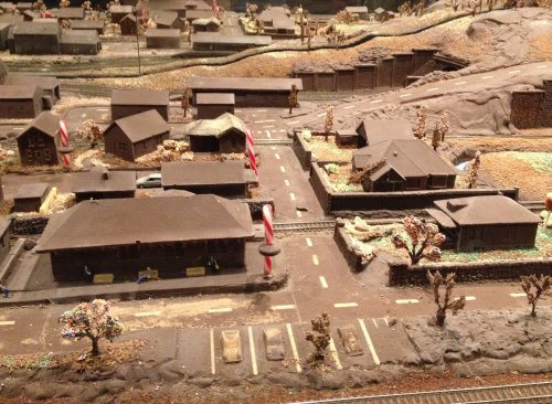 A village made from chocolate. A village with railway all made from chocolate.