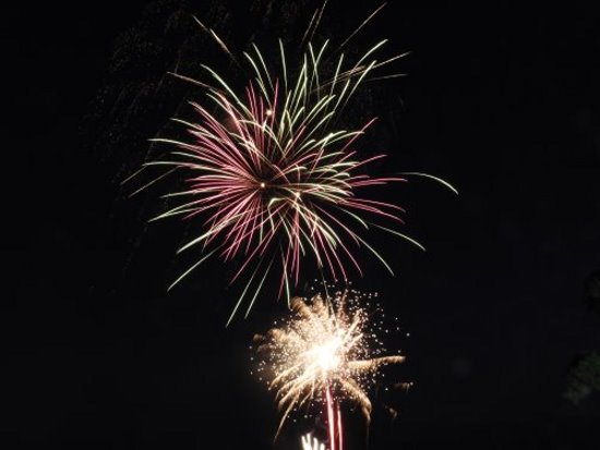 Star shaped fireworks exploding in the sky.