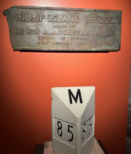 Old Phillip island Bridge sign and mile post on display.