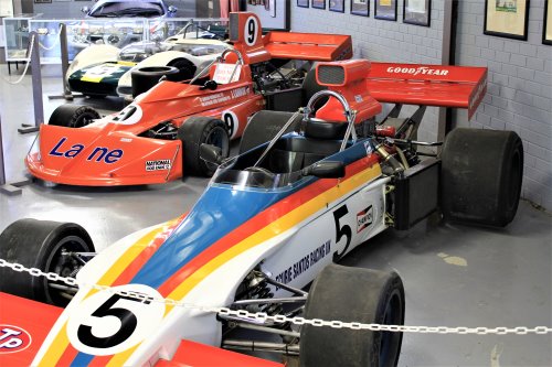Several colourful racing cars on display at the History of Motorsport display at Phillip Island Circuit.