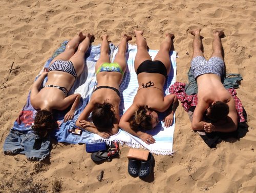 Sunbathers soak up the sun at Cowes Beach, Phillip Island